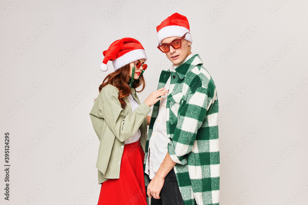 Young couple stand next to each other embrace the New Year holiday togetherness Young couple stand next to each other embrace the New Year holiday togetherness