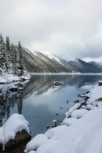 Snow capped mountains and icy lake