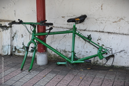 old vandalised bicycle in the street