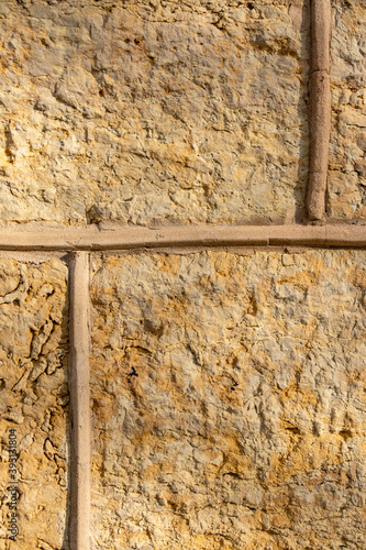 Handcarved sandstone wall closeup detail.