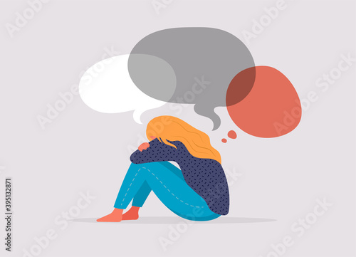 Young woman, teenage girl, suffering from psychological diseases, anxiety. Girl sitting sad by the window or wall