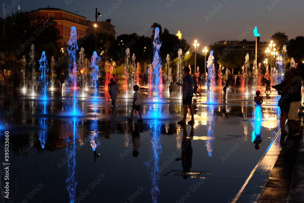 Travel: Children playing in the fountain in the center of Nice