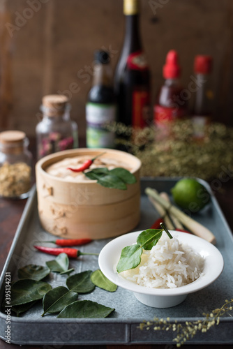 Asian Steamed White Rice Garnished with Fresh Kaffir Lime Leaves. Cooking Ingredients