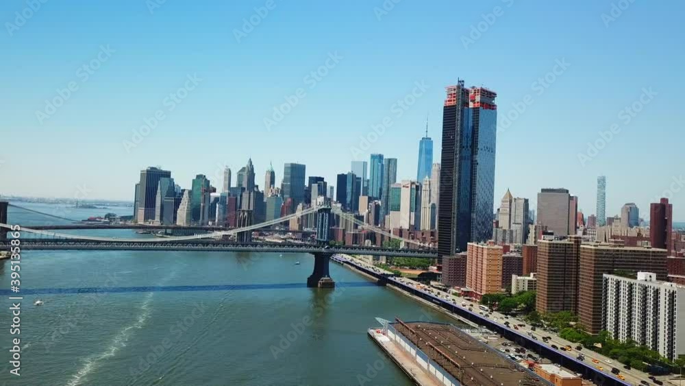 Gorgeous Slider Shot of The Manhattan and Brooklyn Bridge in the foreground and the New York City Skyline in the Background Gorgeous Slider Shot of The Manhattan and Brooklyn Bridge in the foreground and the New York City Skyline in the Background