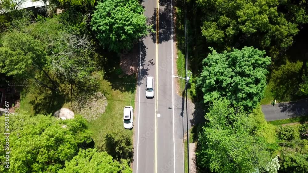 Bird's Eye Camera Tilt of a Suburban Country Road Bird's Eye Camera Tilt of a Suburban Country Road