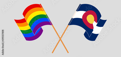 Crossed and waving flags of The State of Colorado and LGBTQ