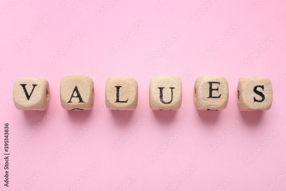 Beads with word VALUES on pink background, flat lay Beads with word VALUES on pink background, flat lay