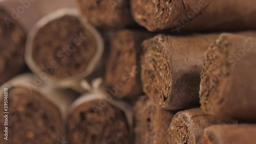 handrolled cuban cigars on white background 4k photo