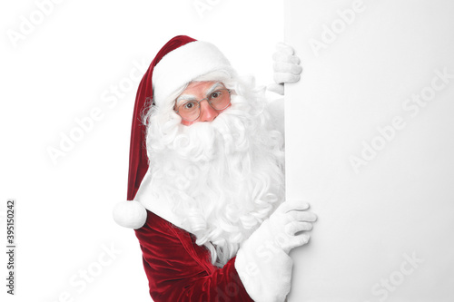 Santa Claus with blank banner on white background © New Africa