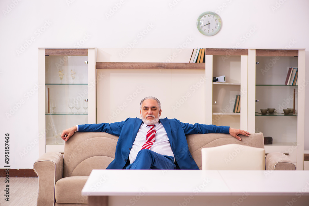 Old male boss employee coming home from work Old male boss employee coming home from work
