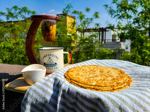 Traditional cheese tortillas from Costa Rica with brewed coffee photo