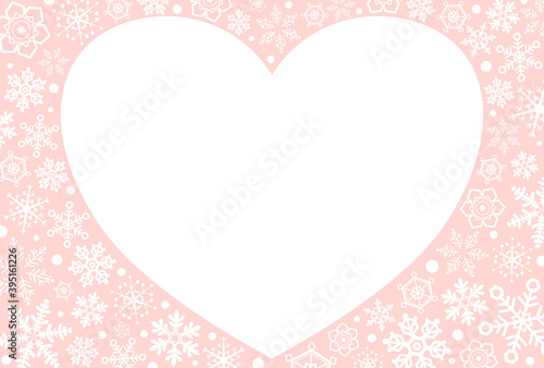 雪の結晶をまわりに散りばめた、淡いピンクのハートのメッセージカード　