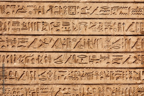 Egyptian hieroglyphs carved in sandstone