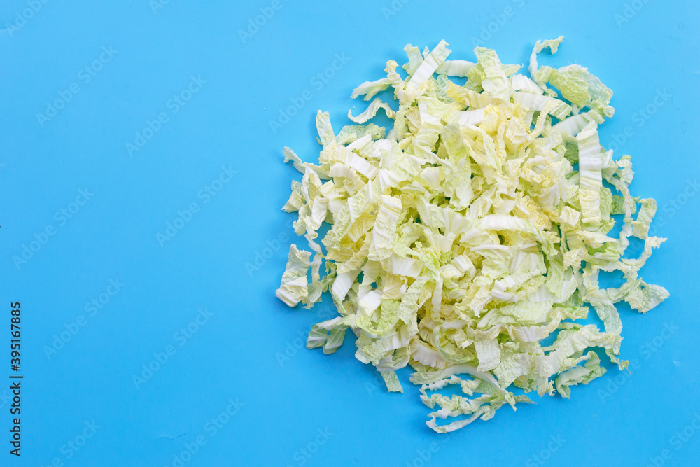Chinese cabbage sliced on blue background Chinese cabbage sliced on blue background