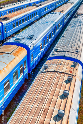 Top View of Standard Blue Railway Carriages At Station Platforms At Daytime. photo