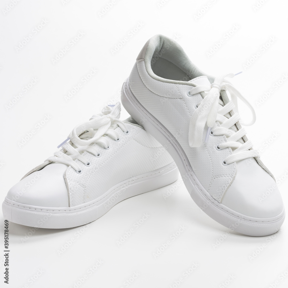 Pair of New White Sneakers Over White Background.