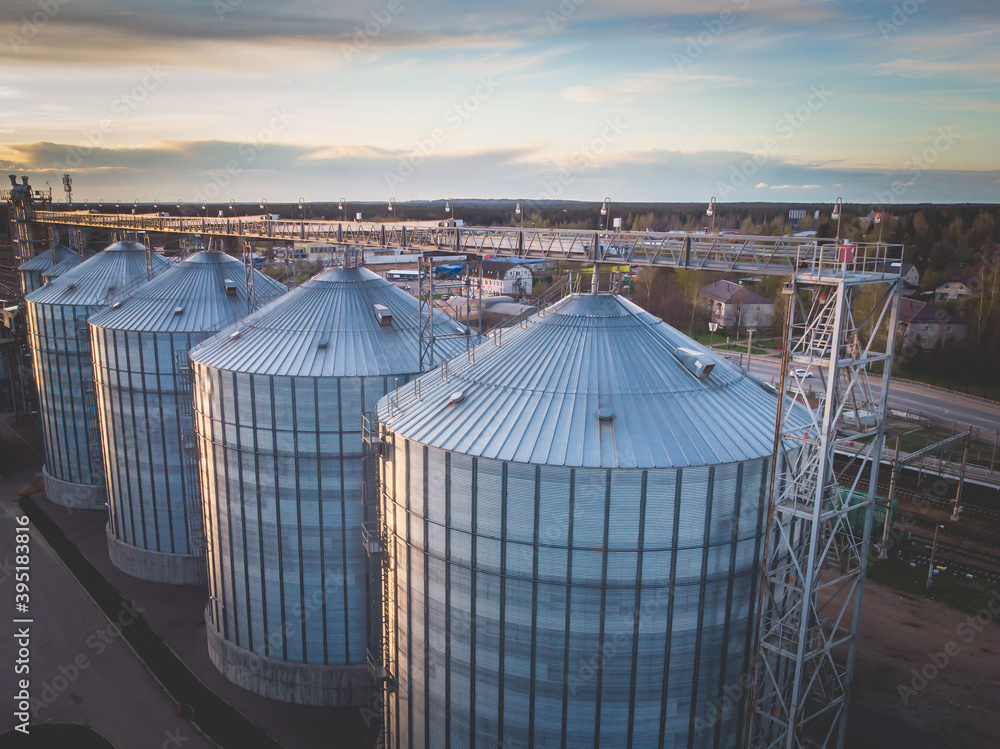 Aerial top view of Grain Elevator Silos, Granary of a feed mill built of modern metal structures Aerial top view of Grain Elevator Silos, Granary of a feed mill built of modern metal structures