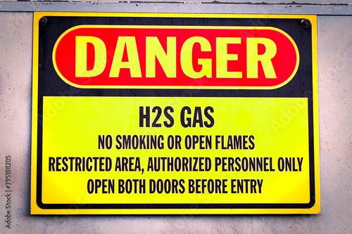 Closeup of a yellow Danger H2S Gas sign