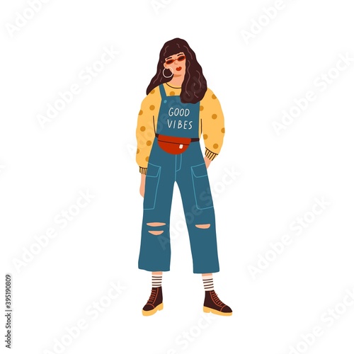 Modern young woman wearing ripped jeans overall, sweater in dots and waist bag. Fashionable casual outfit. Stylish female trendsetter isolated on white background. Flat colorful vector illustration