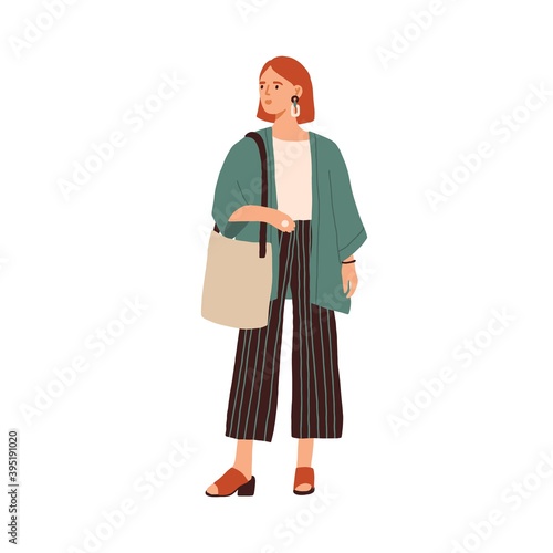 Modern young woman wearing casual clothes. Fashionable outfit. Stylish redhead female in cardigan and culottes isolated on white background. Flat colorful vector illustration