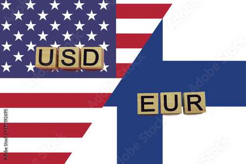 American and Finnish currencies codes on national flags background