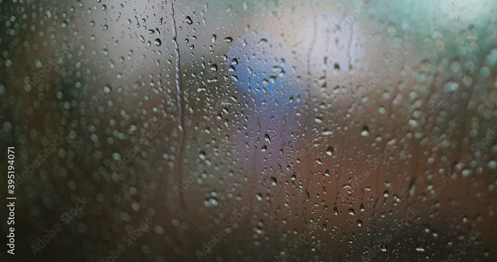 Heavy rain on the glass at night