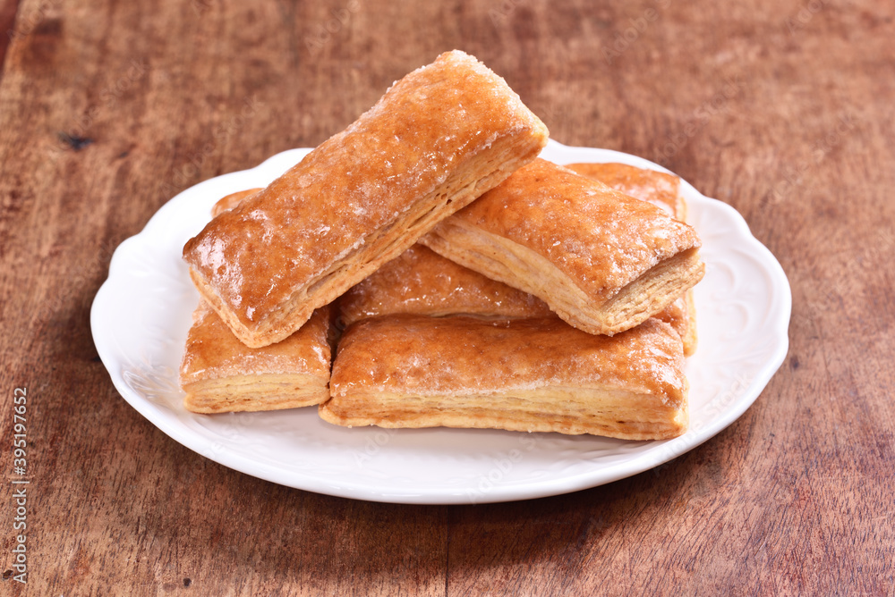 Multi-layered honey biscuit on the white plate Multi-layered honey biscuit on the white plate