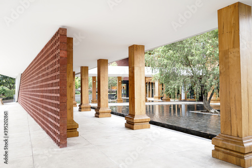Modern structure of corridor terrace in the restaurant with modern garden and stone floor.