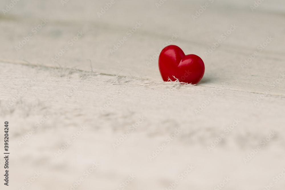 Fototapeta premium Valentines Day background with heart on wood planks