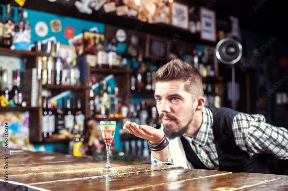 Barman mixes a cocktail on the taproom