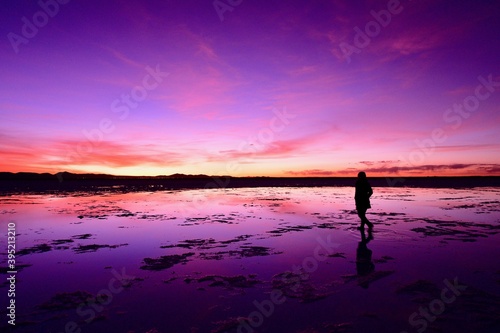 A woman walking in Uyuni salt lake 