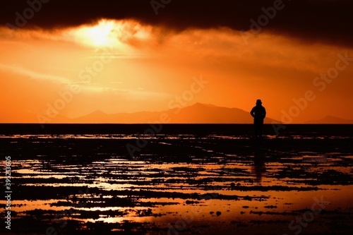 A woman standing in Uyuni salt lake