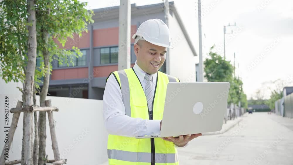 Asian civil engineer operate with laptop to control working on construction site. Worker wearing hard hat using laptop computer standing.4K Resolution.
Asian civil engineer operate with laptop to control working on construction site. Worker wearing hard hat using laptop computer standing.4K Resolution.