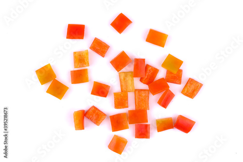 Chopped paprika or red sweet pepper cuts isolated on white background