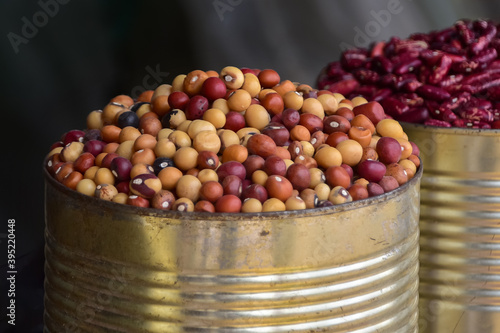 Beans and nuts sold at the local market, bambara groundnuts in a tin can, Manzini market, Swaziland, Eswatini, Africa photo