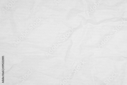 White recycled craft paper texture as background. Grey paper texture, Old vintage page or grunge vignette of old newspaper. Pattern rough art creased grunge letter. Hardboard with copy space for text.