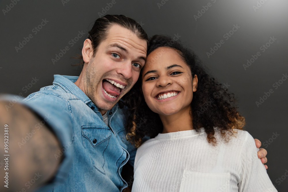 Portrait of happy face of couple using smart phone selfie. Smile happy man and woman online influencer blogger. Closeup cheerful people in romantic relationship. Lifestyle live technology concept Portrait of happy face of couple using smart phone selfie. Smile happy man and woman online influencer blogger. Closeup cheerful people in romantic relationship. Lifestyle live technology concept