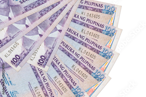 100 Philippine piso bills lies isolated on white background with copy space stacked in fan shape close up photo