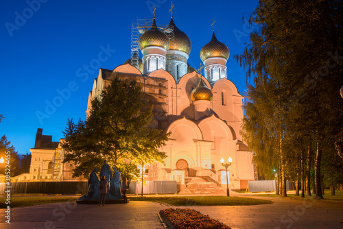 Night view of the Assumption Cathedral of the Blessed Virgin Mary and the sculpture "Holy Trinity"