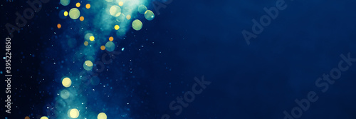 Festive Christmas or New Year blue banner with Christmas lights and snow