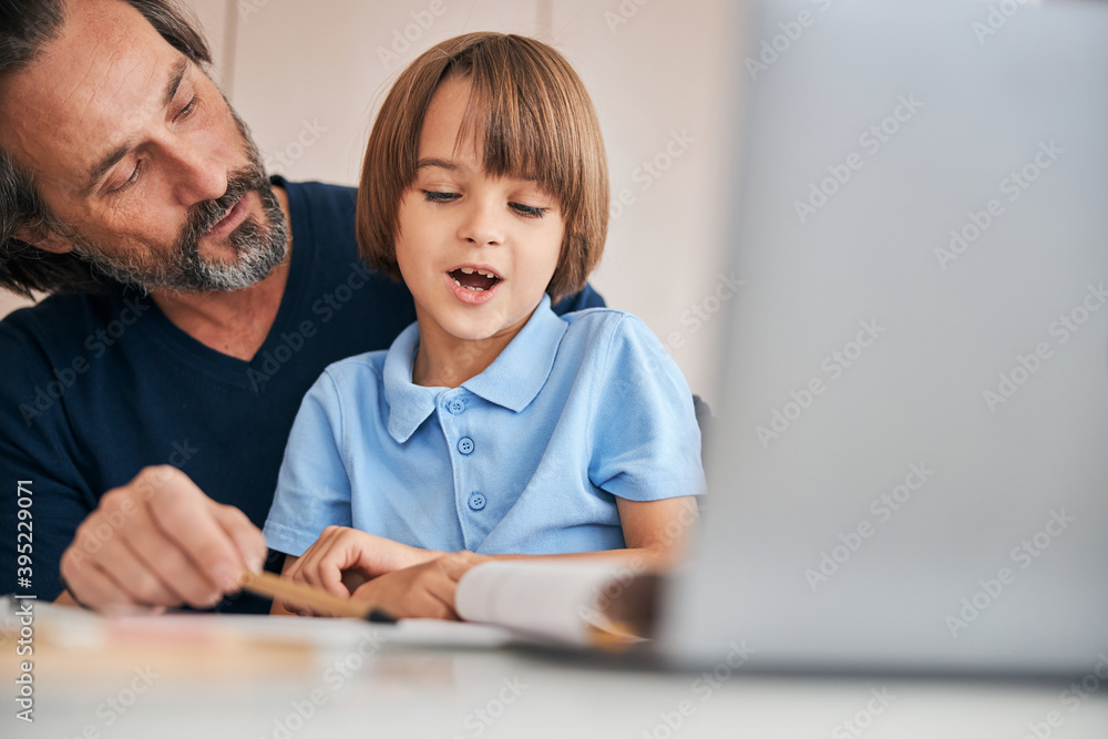 Kid making first steps in the educational process Kid making first steps in the educational process