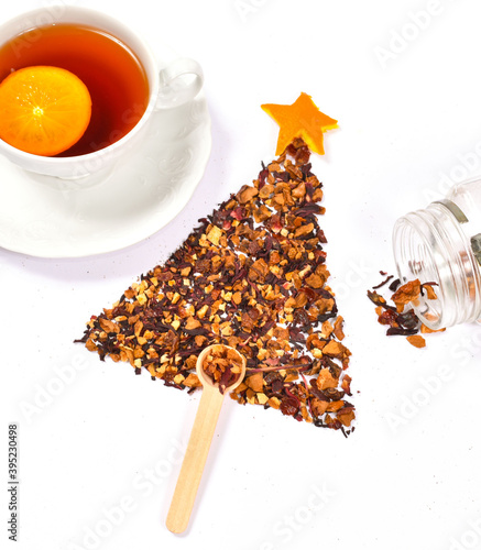 Funny Christmas tree made of herbal orange tea. Christmas and New Year celebtation concept. photo