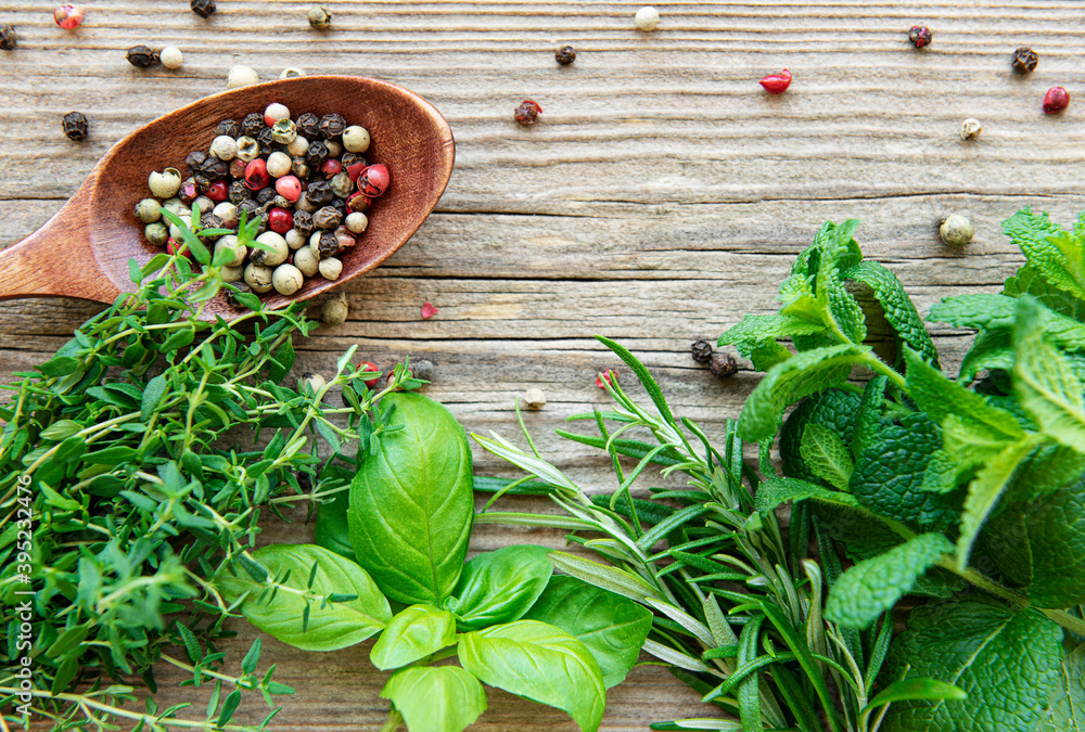 Fresh herbs and spices on wooden background top view Fresh herbs and spices on wooden background top view