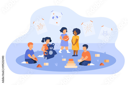 Group of diverse kids playing in kindergarten. Little children with toy pyramid, teddy bear and ball in playroom. For daycare, preschool education, learning games concept