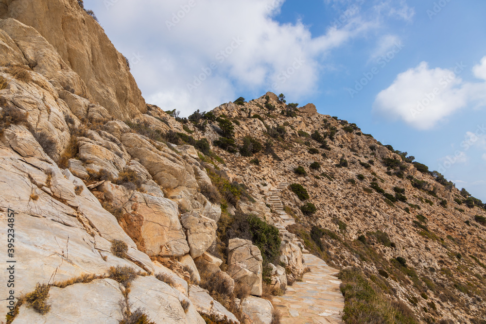 Stone mountain path to Palaiokastro, Ios Island, Greece. Stone mountain path to Palaiokastro, Ios Island, Greece.