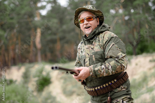 Happy Man with Shotgun Hunting Outdoor Activity.