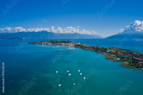 Aerial view of Sirmione high altitude. Sirmione town, Lake Garda, Italy. Aerial panorama