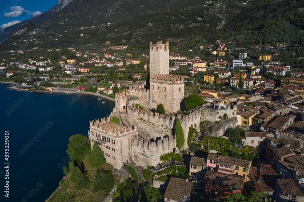 Obraz premium Italian resort on Lake Garda, Monte Baldo. Malcesine town, Lake Garda, Italy. Panoramic aerial view of Scaliger Castle in Malcesine, Malcesine town.
