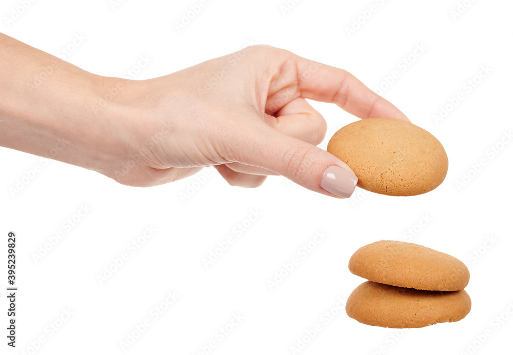 Hand with home made cookie isolated on white background. Hand with home made cookie isolated on white background.