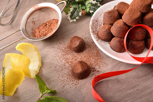 Chocolate truffles with cocoa powder and ingredients for event elevated